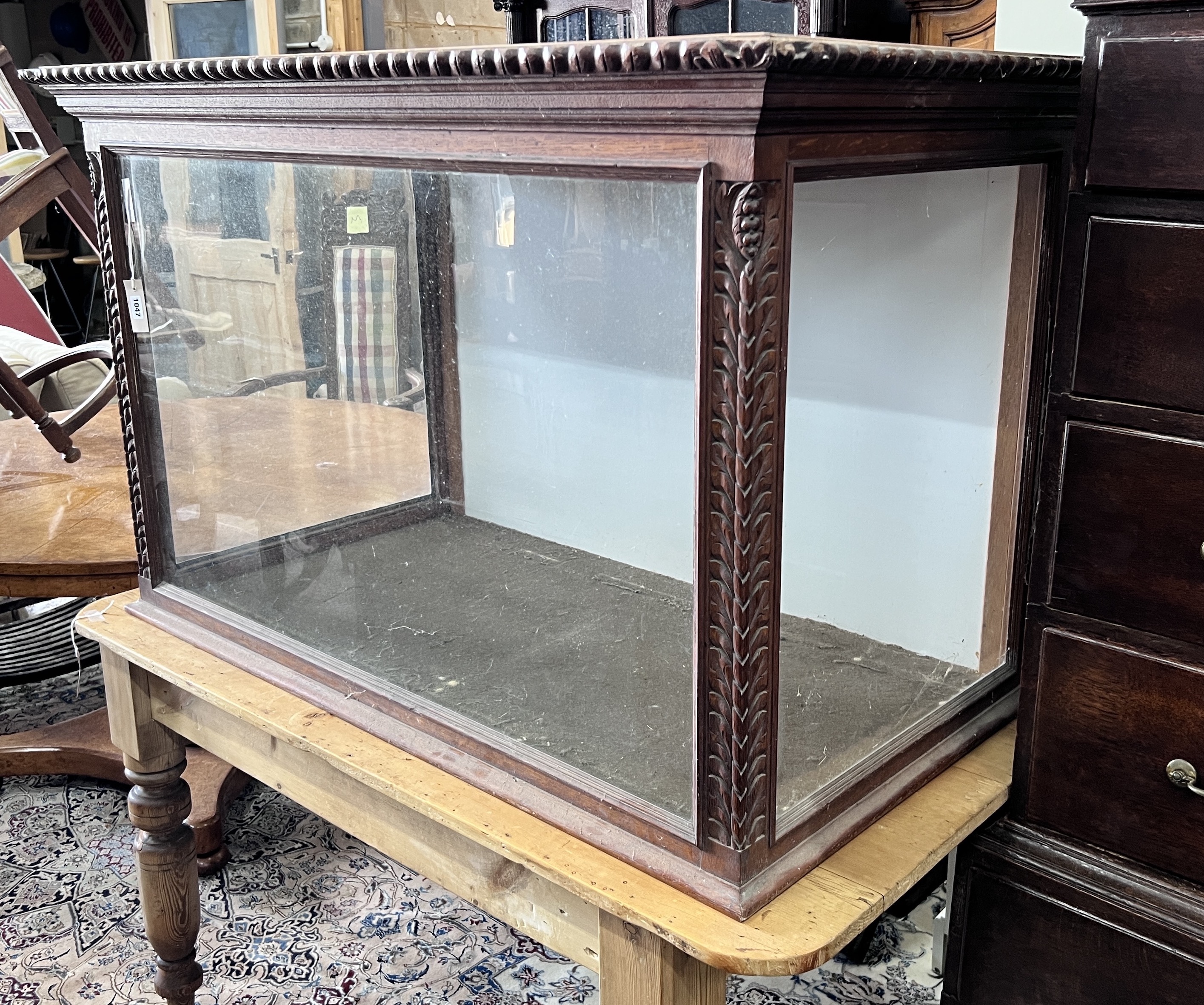 A Victorian carved oak display case with hinged top, width 122cm, depth 66cm, height 78cm